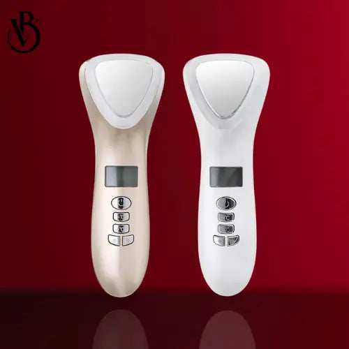 "Two LED light therapy facial devices, one gold and one white, featuring buttons and a digital display, set against a red bac