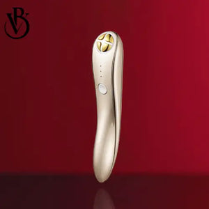 "Gold-colored RF eye rejuvenation device with curved design, four-button interface, resting against a red background."
