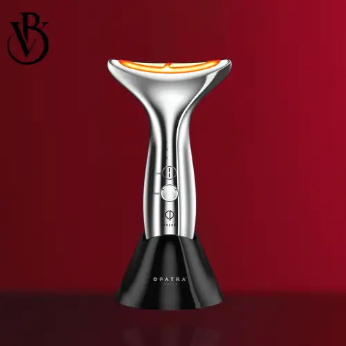 Silver neck firming device with a curved handle, orange LED light, and black base, against a red background.