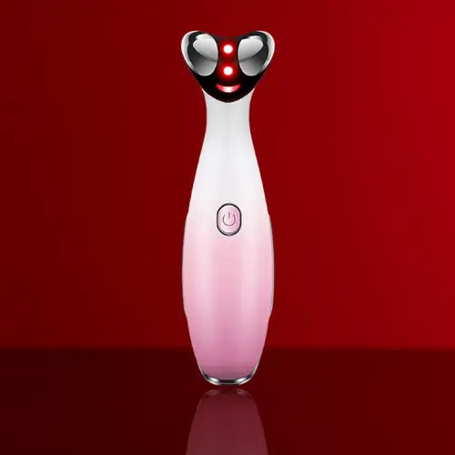 "RF eye massager with a sleek white and pink body, black rounded top, and three red LED lights, front view."