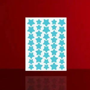 "Sheet of aqua star-shaped acne patches with a white backing, arranged in a grid pattern on a red background."