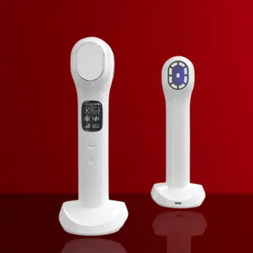 "White dual-head RF facial device with buttons and LED display, standing on a red background."