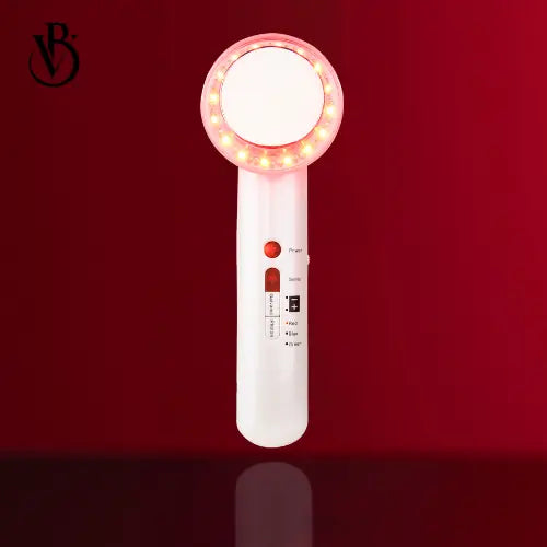 "White handheld device with a circular head, red LED lights around the edge, and control buttons on the body."