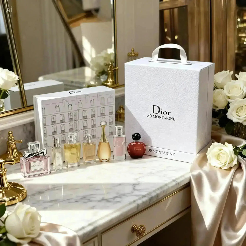 "Five miniature perfume bottles in clear glass, displayed in a white box with a Dior logo, on a marble surface."
