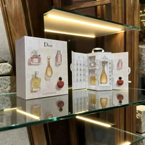 "Dior Mini Perfume Collection Gift Set with five bottles in elegant packaging, displayed on a wooden shelf with warm lighting