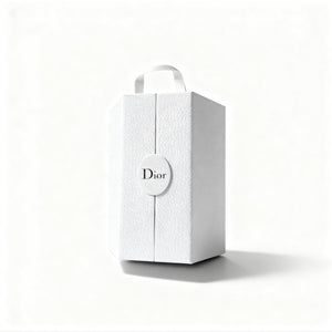 White textured gift box with a circular Dior logo, featuring a top handle and a minimalist design, front view.