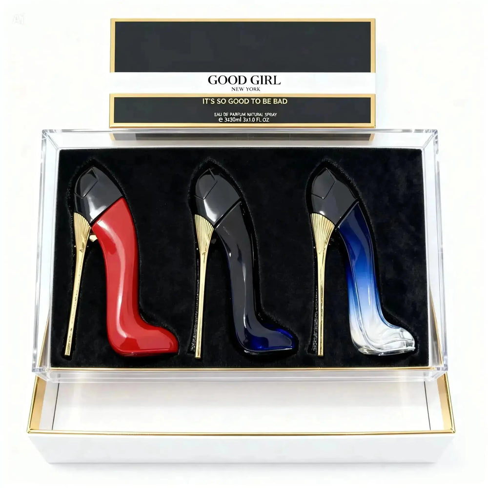 "Three stiletto-shaped perfume bottles in red, black, and blue, displayed in a clear box with a black velvet interior."