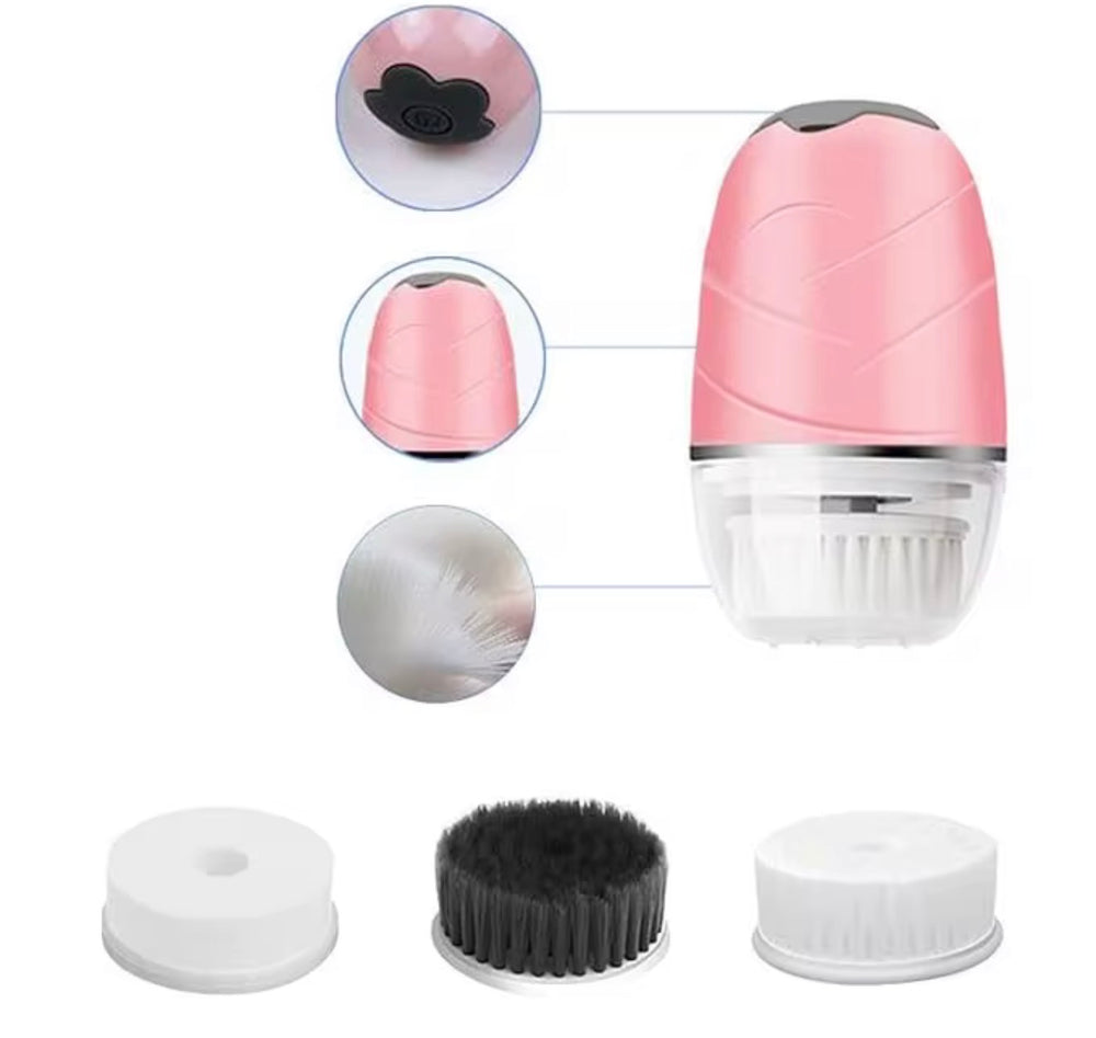 "Pink rotating facial cleansing brush with detachable brush heads, featuring a clear base and silver accents."