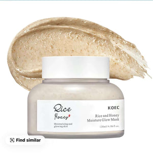 "Clear jar with white lid containing a creamy beige mask, rice grains visible, with a swatch of the mask behind it."