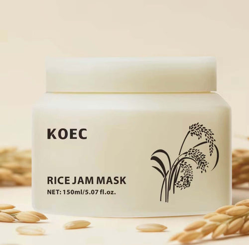 White jar of KOEC Rice Glow Mask with a minimalist design, featuring black rice plant illustration and clear label.