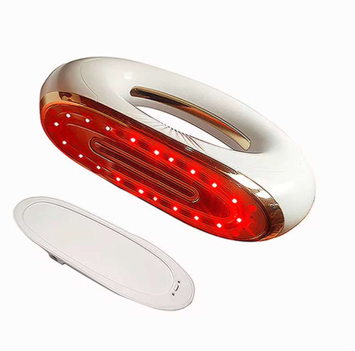 "Gold and white 4-in-1 body sculpting device with red LED lights, oval shape and ergonomic handle, angled view"