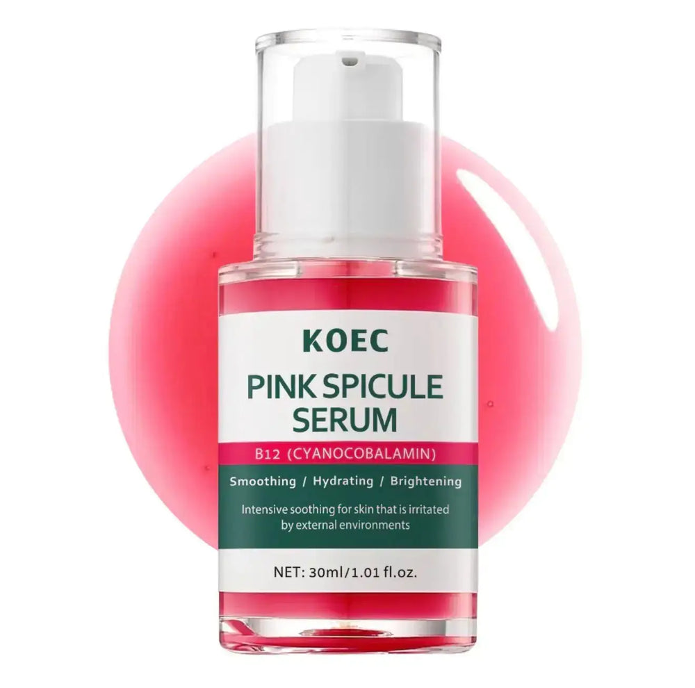 "Clear glass bottle with a pink serum, white pump top, label in green and pink, set against a pink circular backdrop."