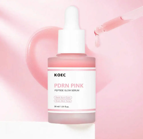 Pink glass serum bottle with a white dropper, featuring a label that reads "KOEC PDRN Pink Peptide Glow Serum," on a soft pin