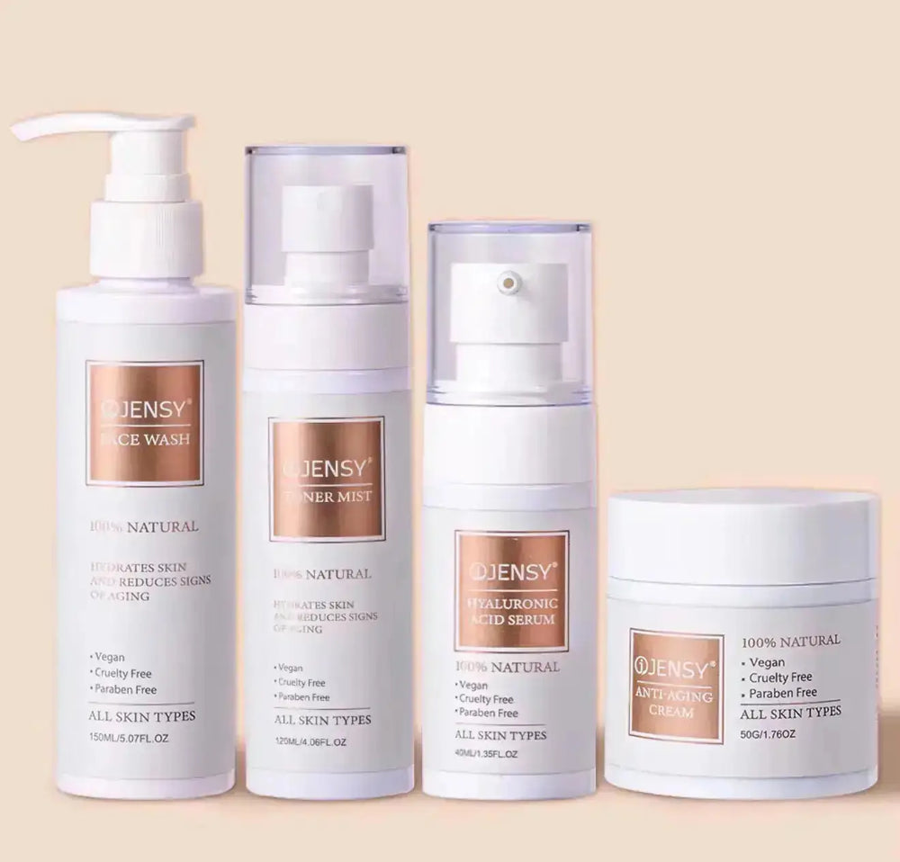 "Four skincare products in white and clear containers, labeled OJENSY, arranged on a light beige background."