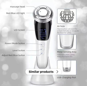 "White and silver 5 in 1 face lift device with LCD screen, buttons, and a circular massage head, front view."