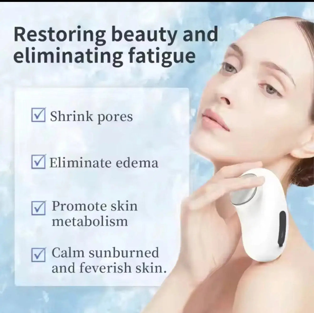 "White and gray facial massager with rounded edges, held in a hand, against a light background."