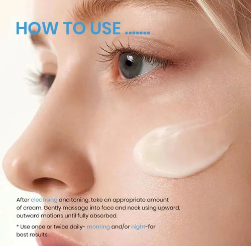 Close-up of a woman's face with light skin applying a translucent cream to her cheek, with soft focus on her eye.