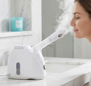 Tabletop facial steamer producing warm mist during use