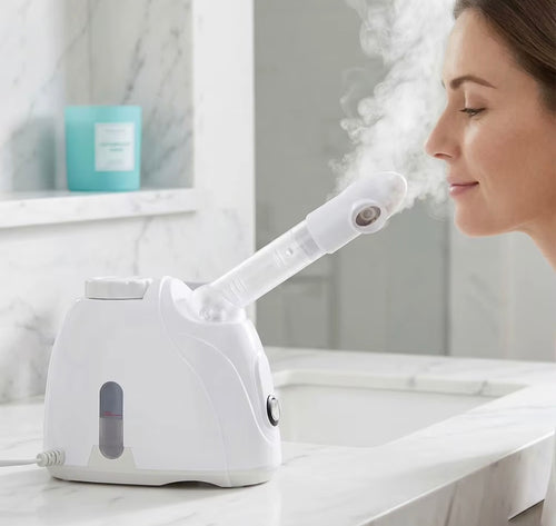 Tabletop facial steamer producing warm mist during use