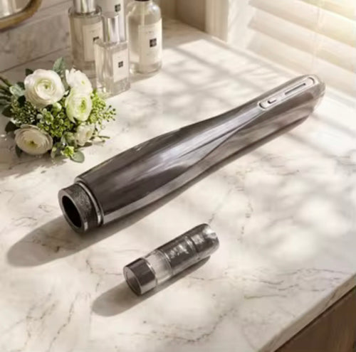 Metallic gray nano water light pen and detached cartridge on a light countertop