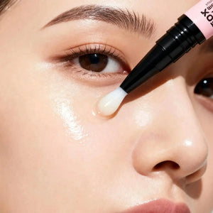 "Transparent gel applied under the eye, with a black and pink applicator tip, highlighting smooth skin texture."